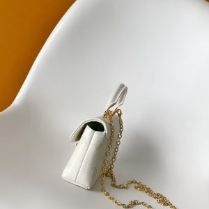 Alternative view of p560M27698 Green M12145 Off-White M12144 Black M12211 Blue M27043 Pink This Nano Madeleine handbag reimagines the Madeleine in Monogram Empreinte leather, featuring a classic S-lock closure and a detachable chain adorned with the LV Circle emblem.Ample space accommodates daily essentials, suitable for hand-carrying, shoulder-carrying, or crossbody wear.12.5 x 6 x 21 cm (H x W x L) Soft grained calf leather Calf leather trim Fabric lining Metal hardware Patch pocket with card slots Accordion compartment S-lock clasp Chain: Z06 Chain length: 56.0 cm Handles: Single handle Made in France, Spain, Italy, or the USA